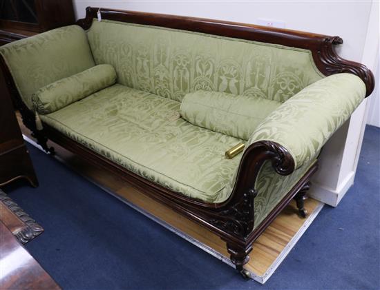 A William IV mahogany scroll end settee, 7ft. D. 2ft 5in. H.2ft 11in.